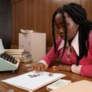 A businesswoman in vintage attire counts coins in a retro office setting.